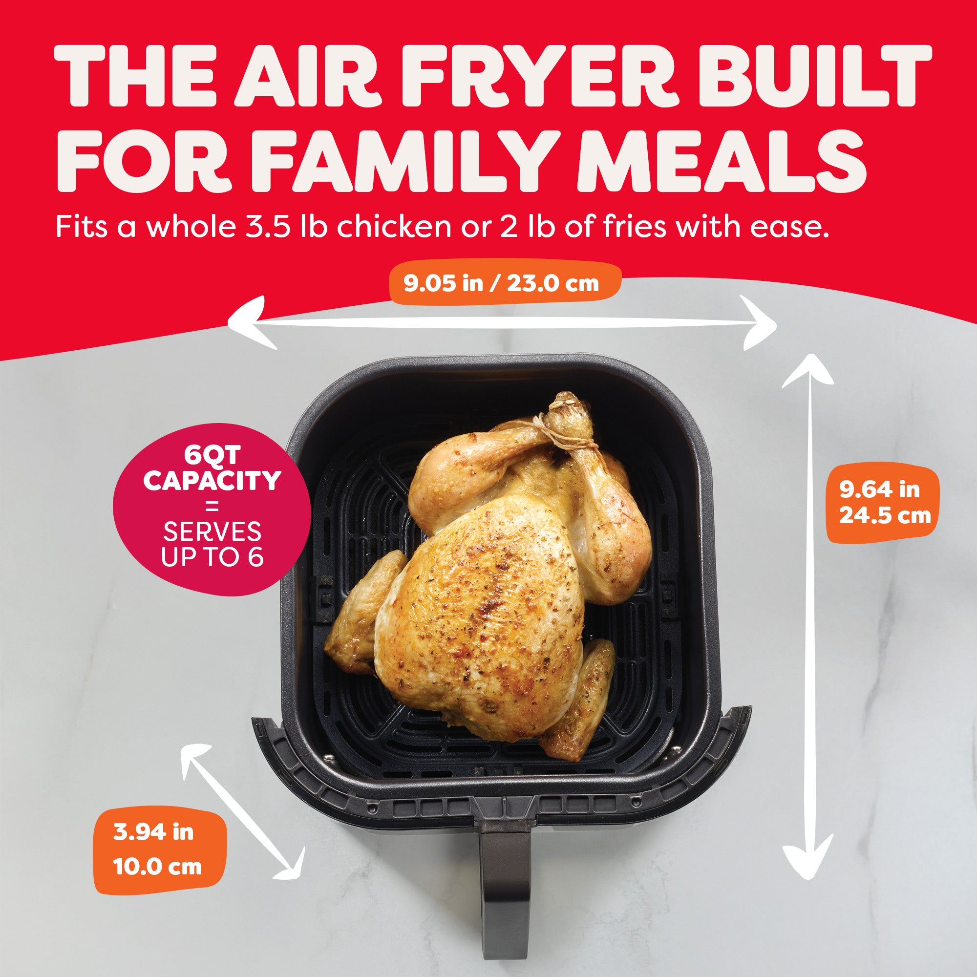 Top view of an air fryer basket containing a whole roasted chicken. Text reads: 'The Air Fryer Built for Family Meals — Fits a whole 3.5 lb chicken or 2 lb of fries with ease.' Basket dimensions labeled: 9.05 in x 9.64 in x 3.94 in. A red circle highlights '6QT capacity = serves up to 6.'