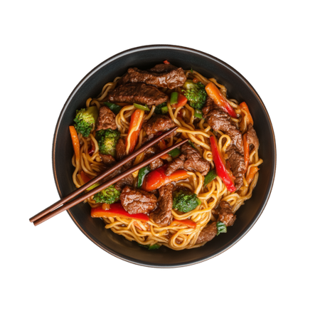 Bowl of stir-fried beef and noodles with red peppers and broccoli served with chopsticks