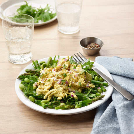 Chicken Curry Salad on Asparagus, Edamame, and Greens