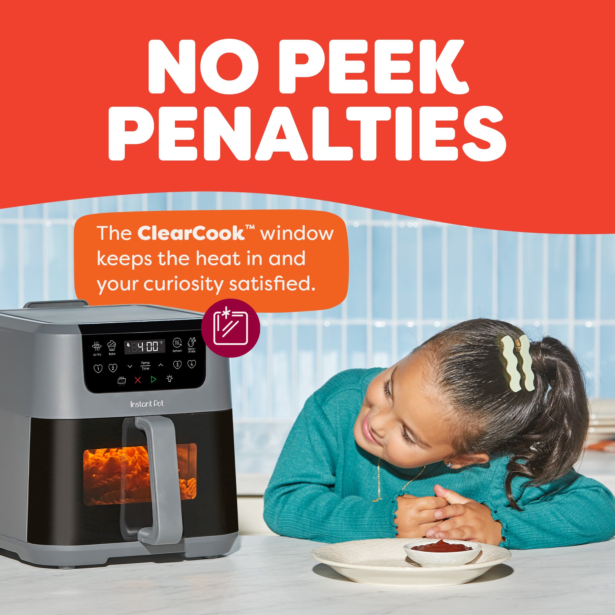 A young girl leans over a table smiling at the air fryer’s ClearCook™ window, which shows food cooking inside. Text notes “No Peek Penalties” since the window lets you watch without losing heat.