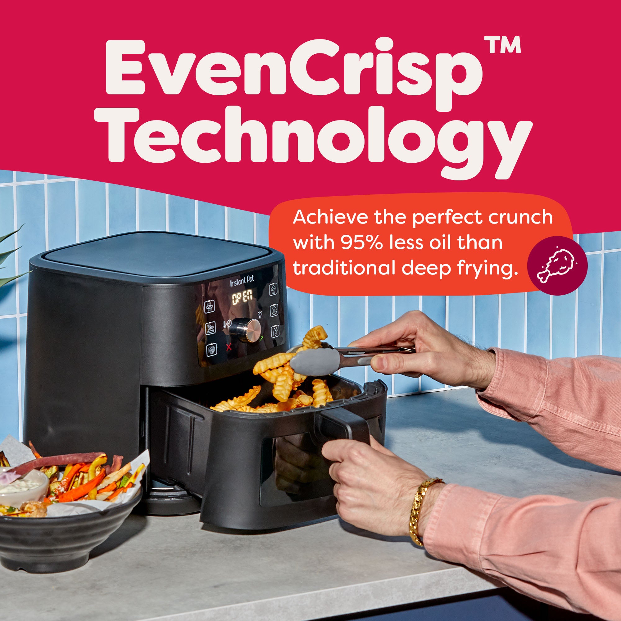 A person uses tongs to remove crispy crinkle fries from the Instant Pot® 4QT Vortex® Plus Mini Air Fryer in Black, which is open on a kitchen counter. The display reads “OFF.” A bowl of roasted veggies sits nearby. Text reads: “EvenCrisp™ Technology – Achieve the perfect crunch with 95% less oil than traditional deep frying.”