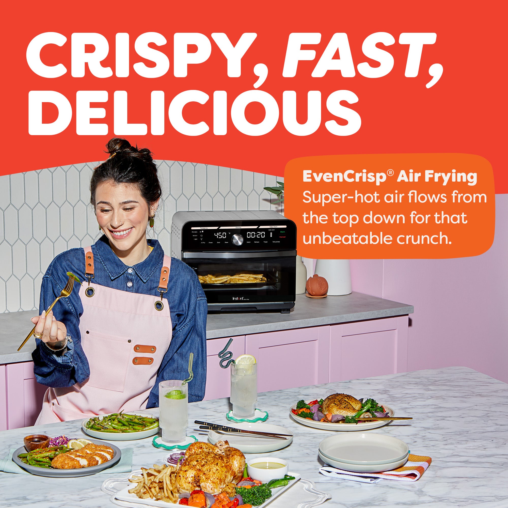 Woman eating near air fryer. Text: 'Crispy, Fast, Delicious – EvenCrisp® cooks with top-down heat for unbeatable crunch.'