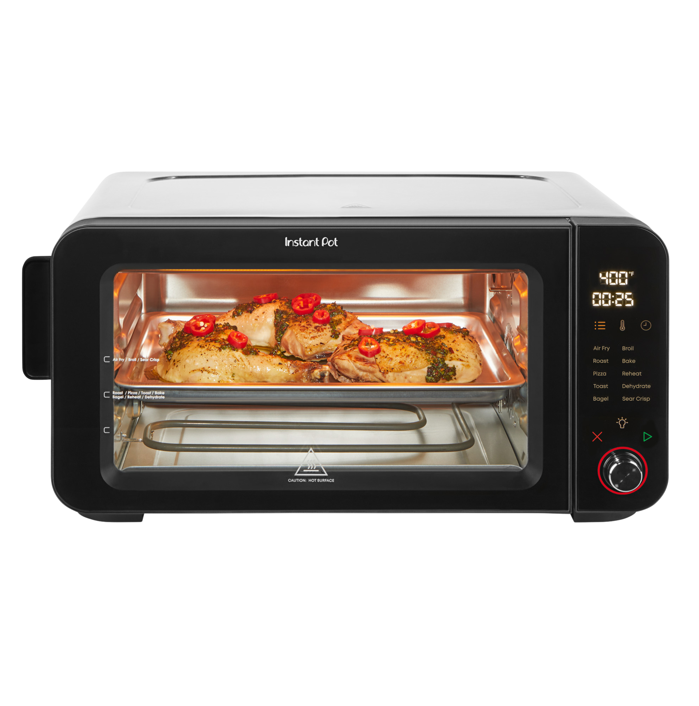 Front-facing view of the Instant Pot® 6-Slice InstantHeat™ Air Fryer Toaster Oven with the door closed. A tray of seasoned chicken and vegetables is visible through the glass window. The digital display shows 400°F and 25 minutes. Touchscreen panel with cooking presets and control knob is on the right.