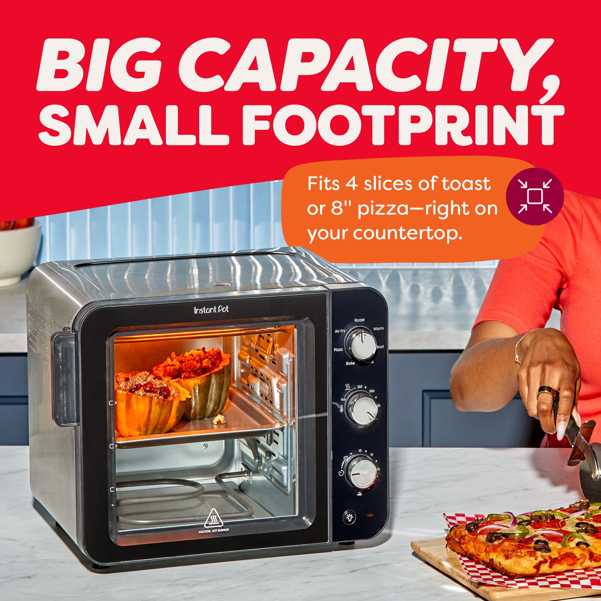 A person slices pizza at the counter while the Instant Pot® 4-Slice InstantHeat™ Mini Air Fryer Toaster Oven cooks stuffed squash. Text highlights “Big Capacity, Small Footprint,” noting it fits four slices of toast or an 8-inch pizza on your countertop.