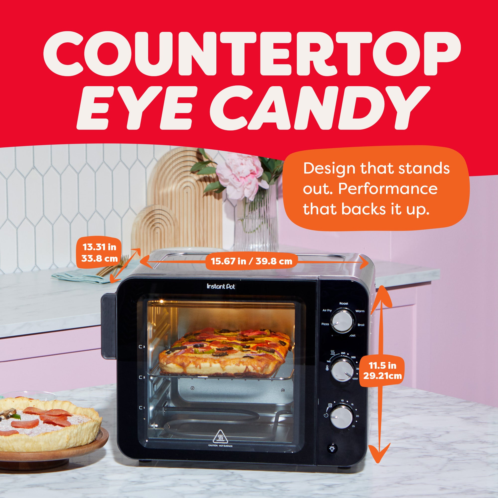 The Instant Pot® 4-Slice InstantHeat™ Mini Air Fryer Toaster Oven sits on a kitchen counter, baking a focaccia-style pizza. Arrows indicate dimensions: 15.67 inches wide, 13.31 inches deep, and 11.5 inches tall. Text reads “Countertop Eye Candy,” highlighting compact size and sleek design.