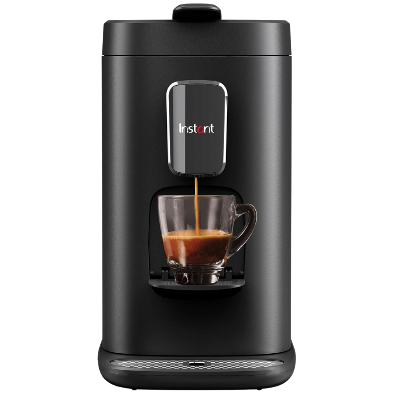 Front view of the Instant™ Dual Pod Coffee Maker. The unit is shown in use, with coffee pouring into a cup located underneath the spout, on the unit's cup ledge.