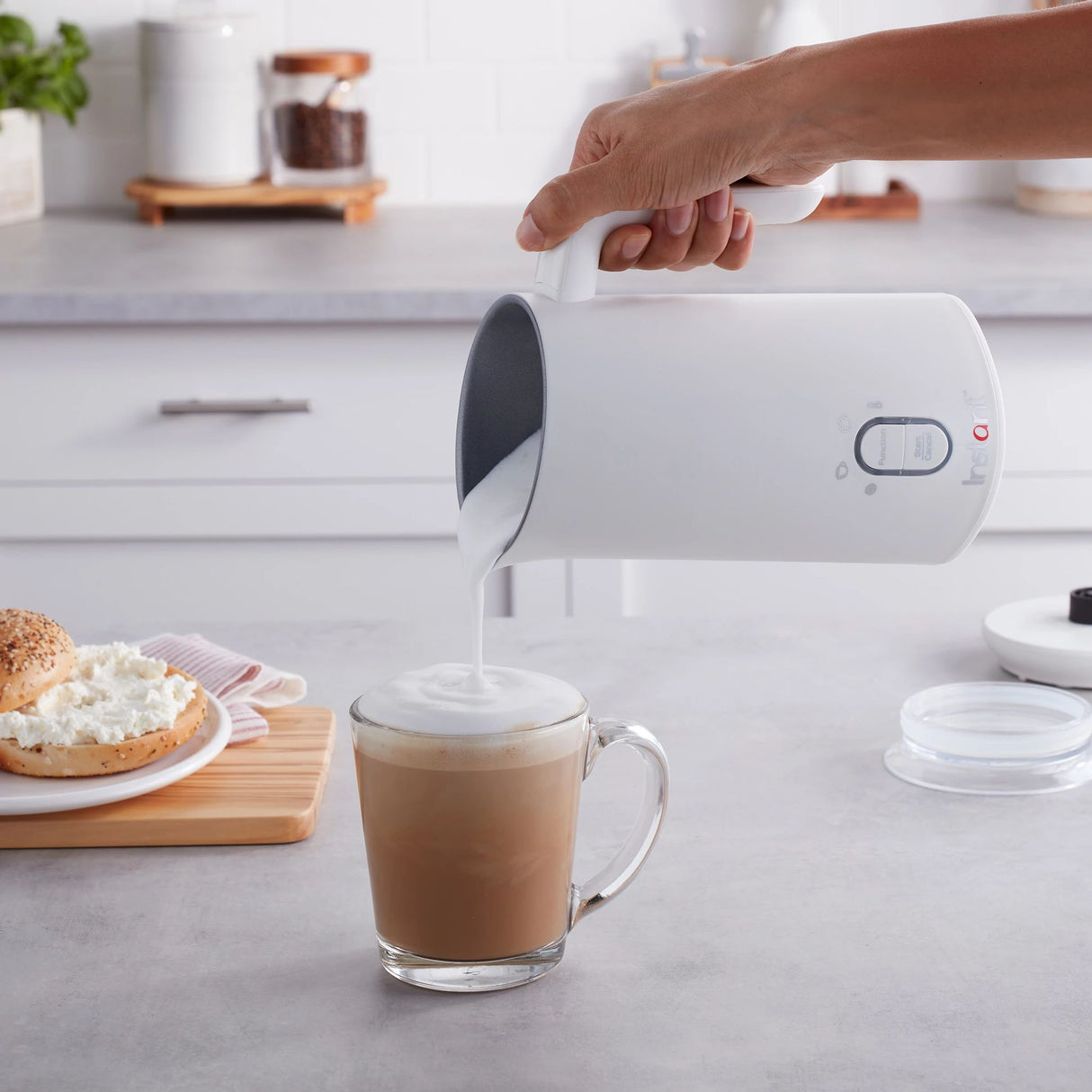  Instant™ White Milk Frother being used to pour coffee