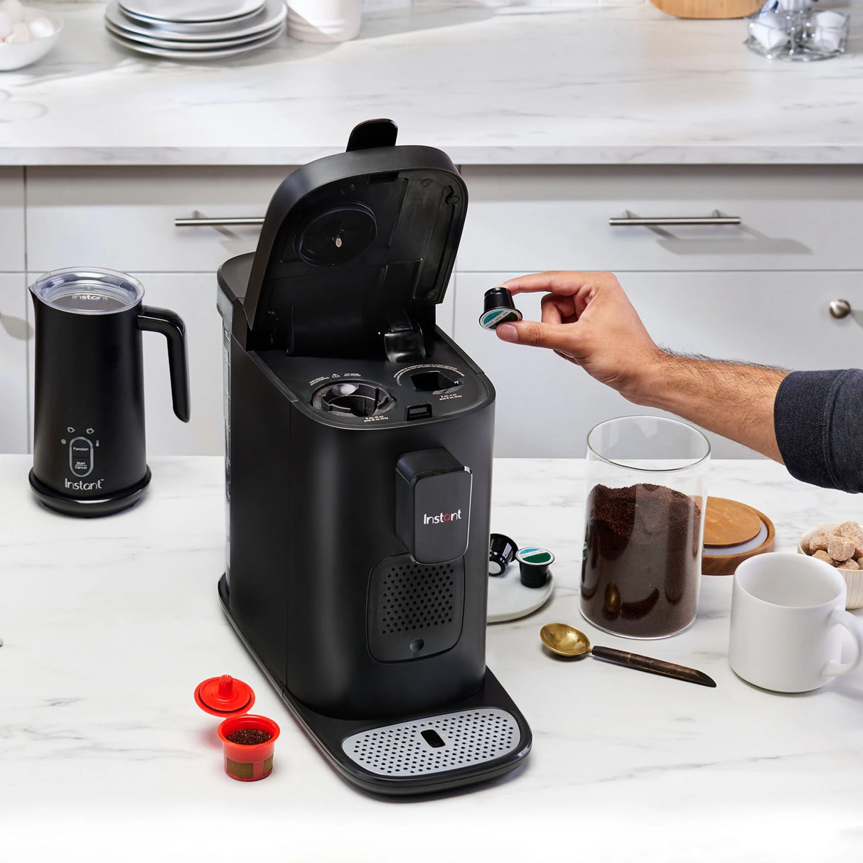  Instant™ Dual Pod Coffee Maker open putting pod into machine 